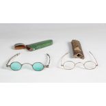A George III shagreen and white metal mounted spectacles case, length 13cm, containing a pair of