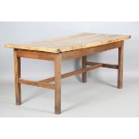 A 19th century sycamore and oak farmhouse table, the cleated two-plank top on chamfered block