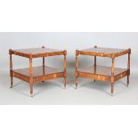 A pair of late 20th century reproduction yew two-tier lamp tables, each fitted with a single drawer,