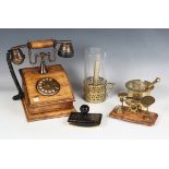 A group of collectors' items, including a replica cradle telephone, width 19cm, a brass pestle and