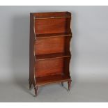 An early 20th century mahogany and brass mounted four-tier waterfall bookcase, in the manner of