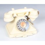 An early 20th century ivory Bakelite 200 series telephone, the underside detailed '1/232L S55/2'.