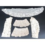 A selection of mainly 19th century lace, including various fichus, a Brussels veil and two pairs