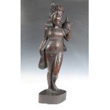 A Balinese carved hardwood standing figure of a lady, height 69cm.Buyer’s Premium 29.4% (including