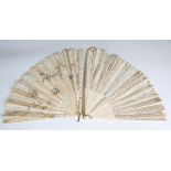 A 19th century bone and piqué inlaid folding fan with lacework panel, length 35cm, together with