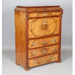 A late 19th century burr walnut escritoire with overall crossbanded borders and carved pilasters,