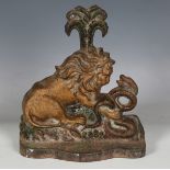 A Victorian painted cast iron doorstop in the form of a lion and serpent, detailed 'Clark & Co' to