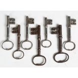 A group of seven late 19th century steel keys, length of longest 14cm.Buyer’s Premium 29.4% (