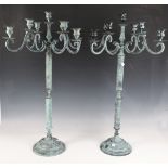 A pair of modern verdigris patinated metal nine-light candelabra, height 73cm.Buyer’s Premium 29.