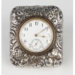 A Victorian silver mounted desk watch, the white enamelled dial with black Arabic numerals and