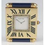 A Cartier quartz gilt brass and blue enamelled folding travelling timepiece with signed white