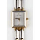 A Michel Herbelin Paris steel and gilt metal rectangular cased lady's bracelet wristwatch, the