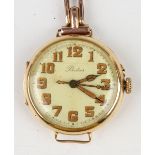 A Packer 18ct gold circular cased wristwatch, the gilt jewelled lever movement detailed 'Swiss