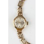 A Rotary 9ct gold cased lady's bracelet wristwatch, the signed circular silvered dial with gilt