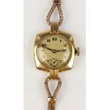 An 18ct gold cased lady's wristwatch with circular jewelled Swiss movement, the silvered dial with