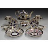 A Ridgway part tea service, circa 1810, pattern No. 2/24, painted with gilt fruiting vine on dark