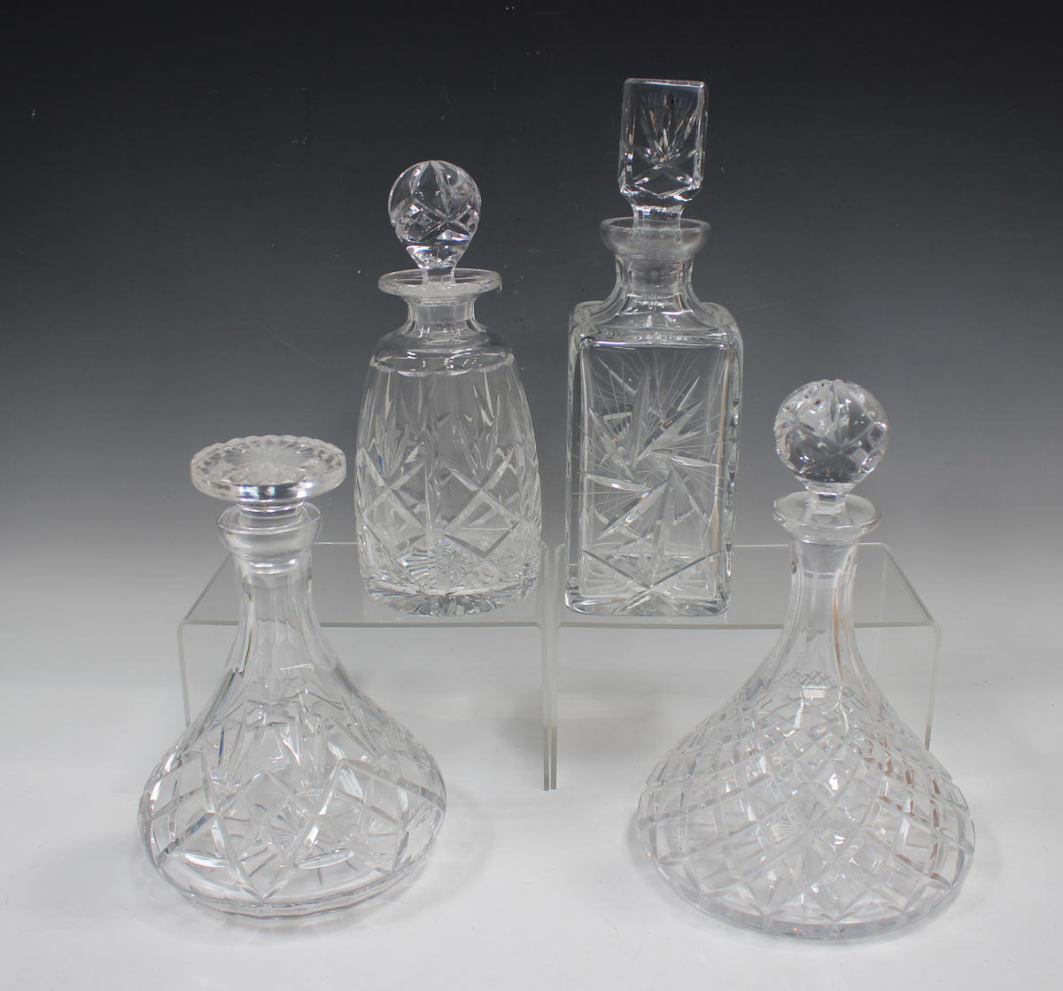 A mixed group of twenty-five assorted glass decanters and stoppers, 20th century, mostly cut - Image 2 of 4