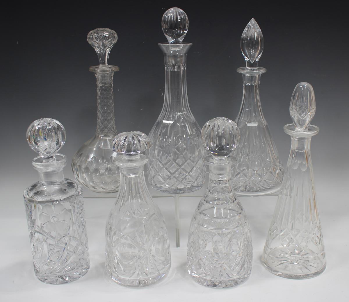 A mixed group of twenty-five assorted glass decanters and stoppers, 20th century, mostly cut - Image 4 of 4