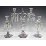 A Baccarat style two-branch candelabrum with a pair of matching candlesticks, first half of 20th