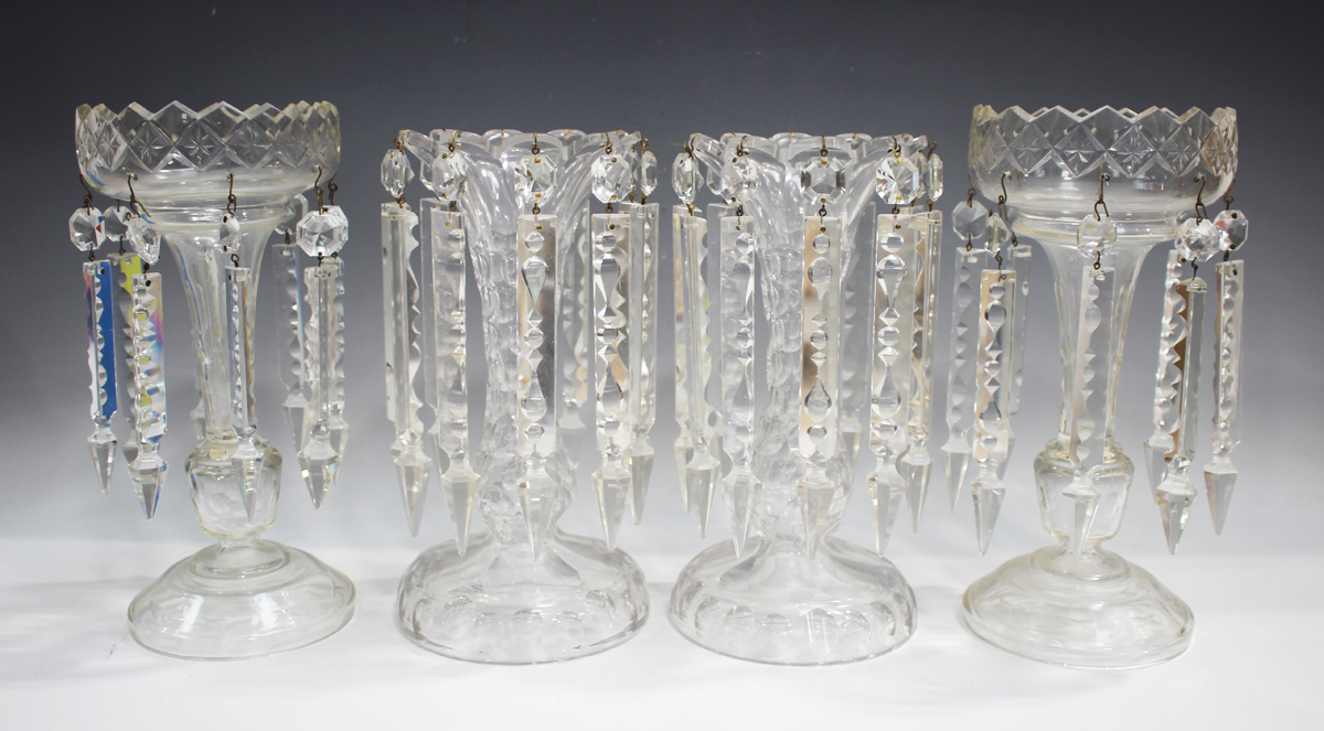 A pair of clear cut glass table lustres, early 20th century, the baluster stems cut with circular