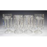 A pair of clear cut glass table lustres, early 20th century, the baluster stems cut with circular