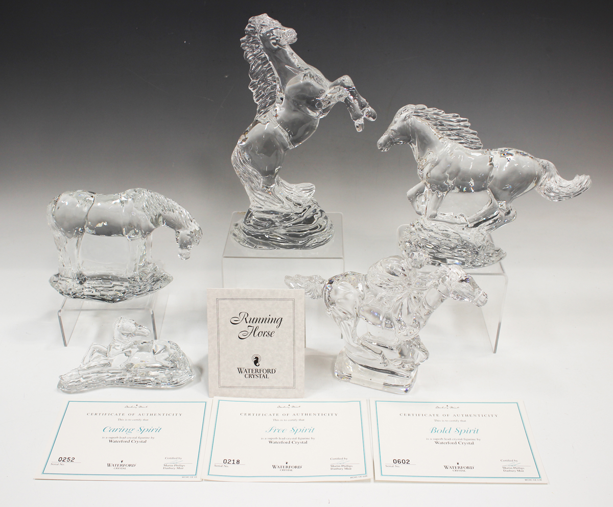 Five Waterford Crystal horse models, comprising one mounted with a jockey, Caring Spirit, which is a