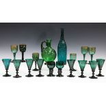 A matched set of eight green glass wines, late 19th/20th century, each conical bowl engraved with