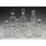 A mixed group of twenty-five assorted glass decanters and stoppers, 20th century, mostly cut