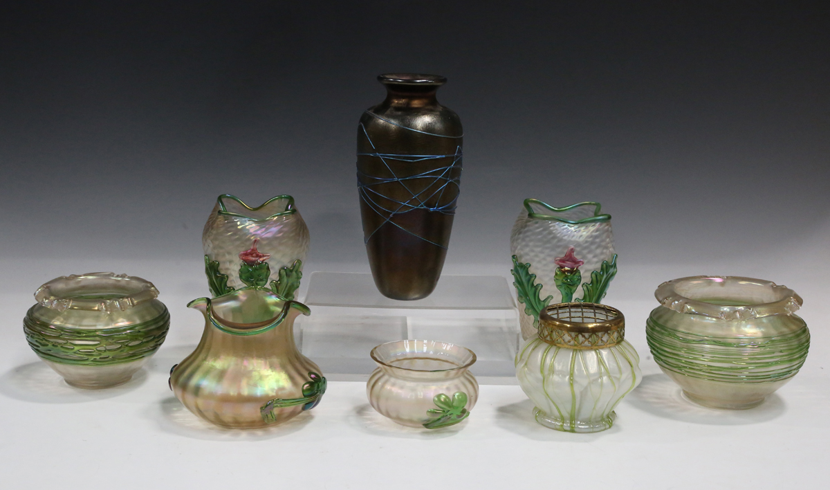 A pair of Kralik Applied Flower iridescent glass vases, circa 1900, of oval form with crimped