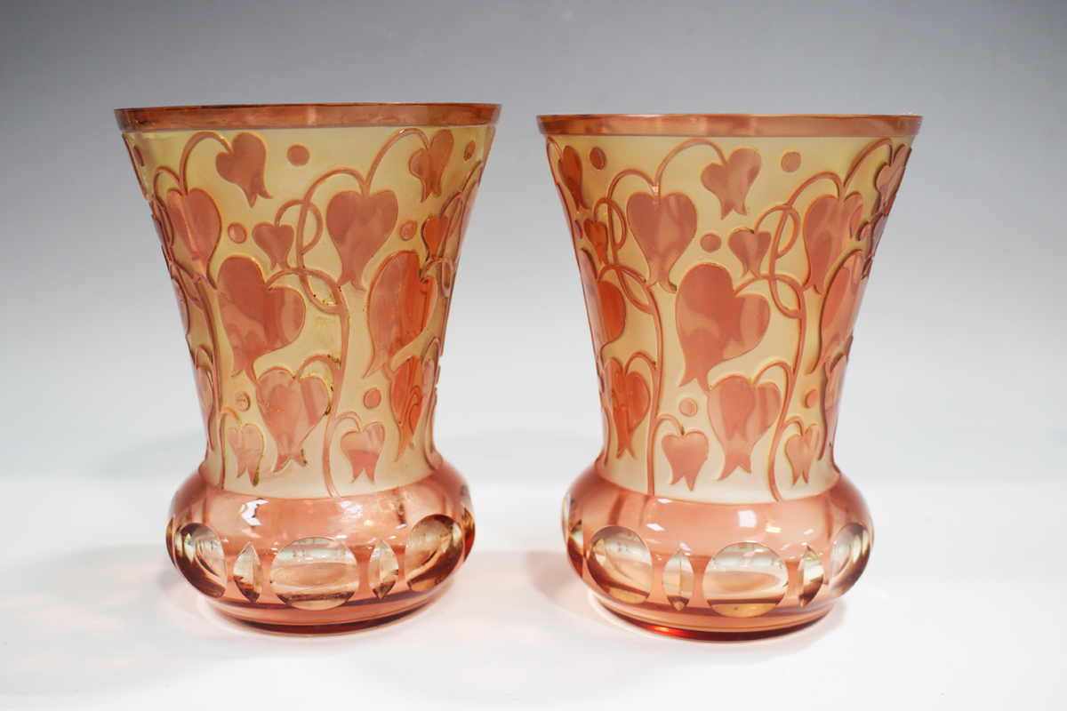 A pair of pale cranberry and amber flashed cut glass vases, probably Continental, 20th century, of