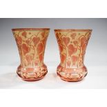 A pair of pale cranberry and amber flashed cut glass vases, probably Continental, 20th century, of
