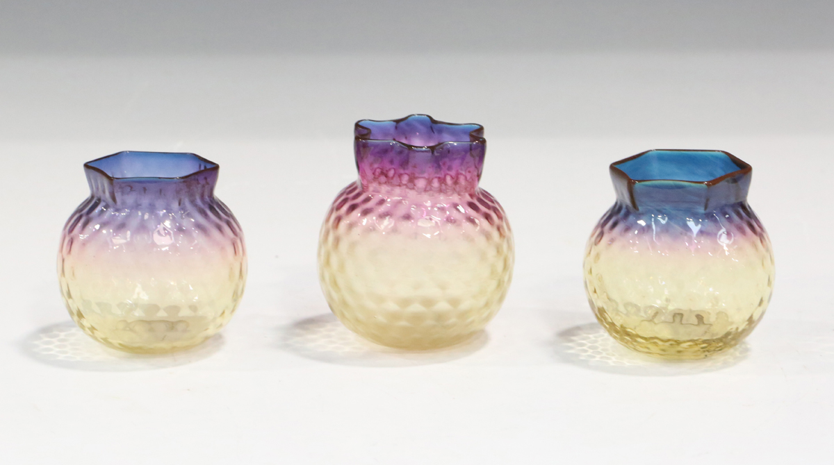 A matched pair of Alexandrite glass posy vases, Thomas Webb & Sons, circa 1900, the dimpled