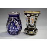 A blue flashed and cut glass vase with silver overlay decoration, the bulbous body with three