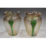 A pair of Kralik iridescent glass vases, circa 1930, the tapered bodies of pale colour with wavy