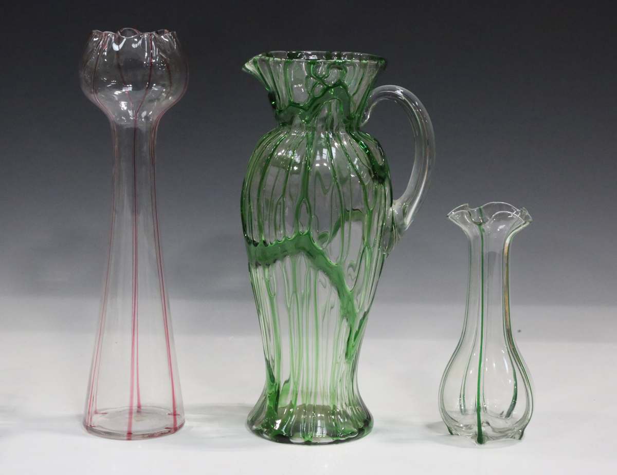 A Stevens & Williams Fibrilose glass jug, circa 1900, the clear baluster body trailed with haphazard