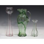 A Stevens & Williams Fibrilose glass jug, circa 1900, the clear baluster body trailed with haphazard