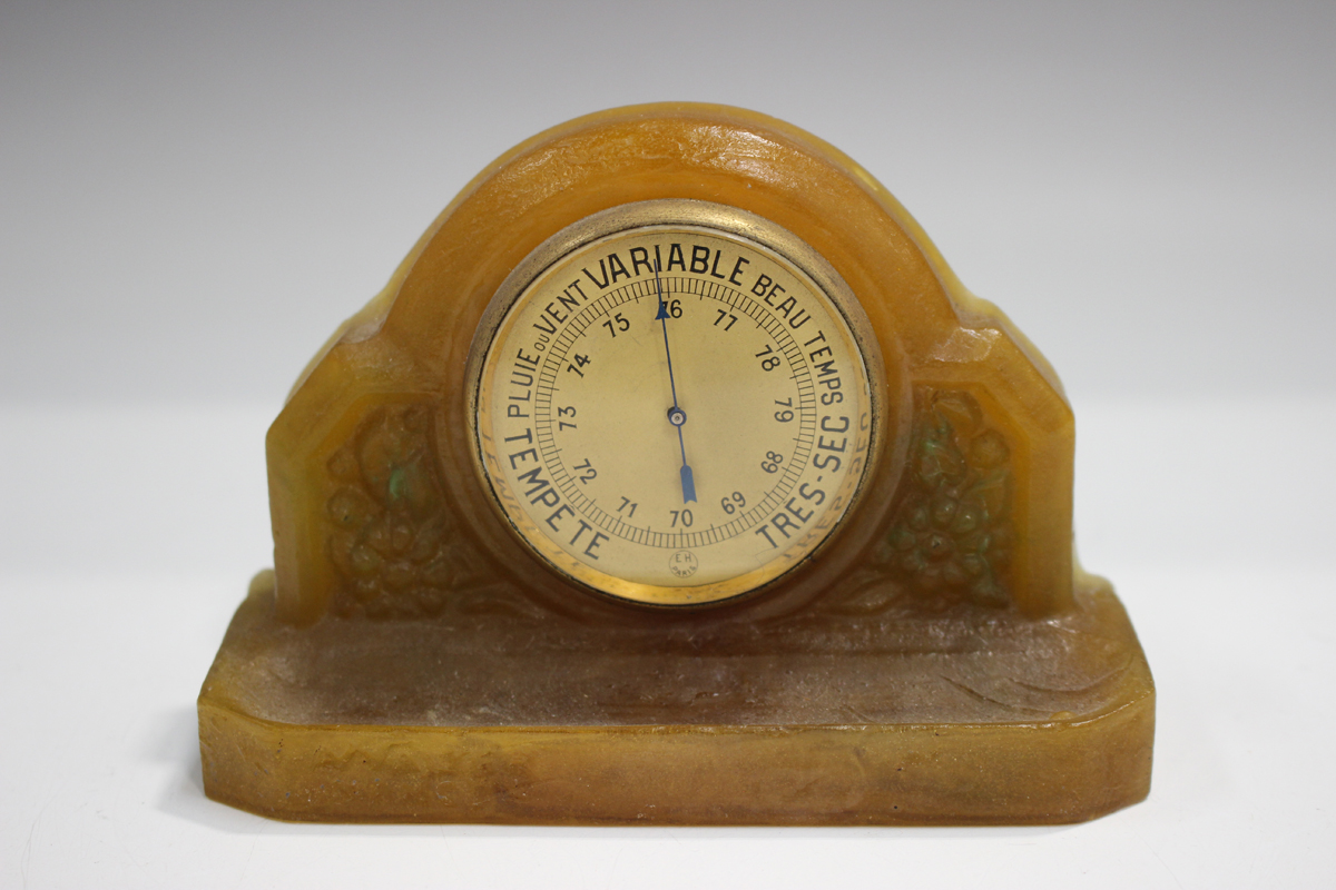 An Almeric Walter pâte-de-verre glass desk barometer, 1920s, of arched form, housing a circular