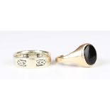 A 9ct gold and black onyx oval signet ring, Birmingham 1965, ring size approx W, and a 9ct gold band