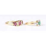 A gold, ruby and diamond ring, mounted with three oval cut rubies alternating with two pairs of