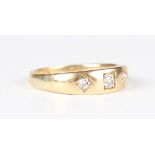 A Victorian 18ct gold and diamond three stone ring, mounted with cushion cut diamonds, Birmingham