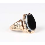 A Victorian gold and banded agate horseshoe shaped signet style ring with decorated shoulders,