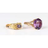 A 9ct gold ring, claw set with a circular cut amethyst, London 1963, fitted with a sizing band,