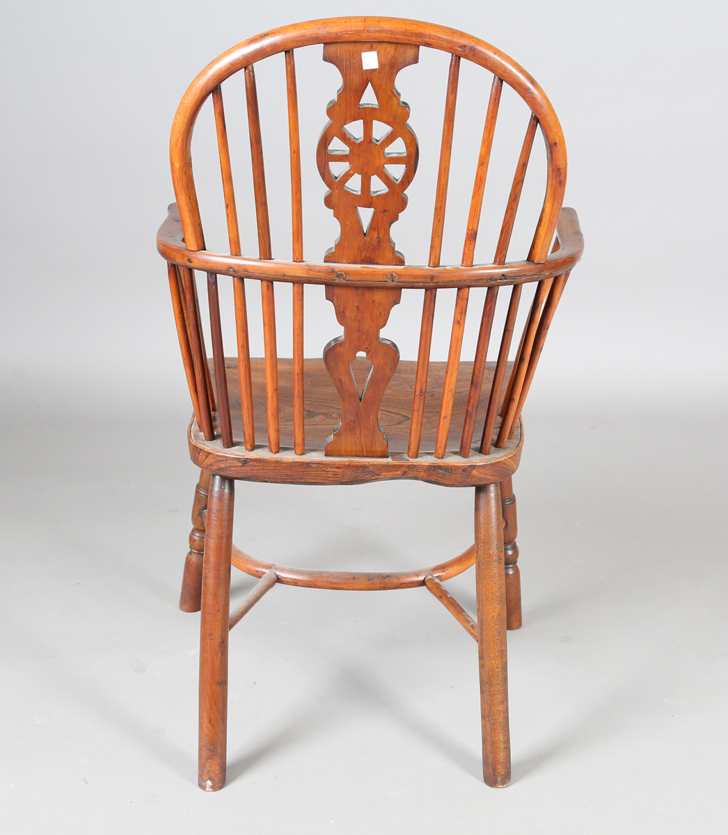 An early Victorian yew and elm stick and wheel back Windsor armchair with shaped panel seat and - Image 4 of 14