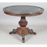 A mid-19th century French mahogany circular centre table, the veined dark grey marble top with a