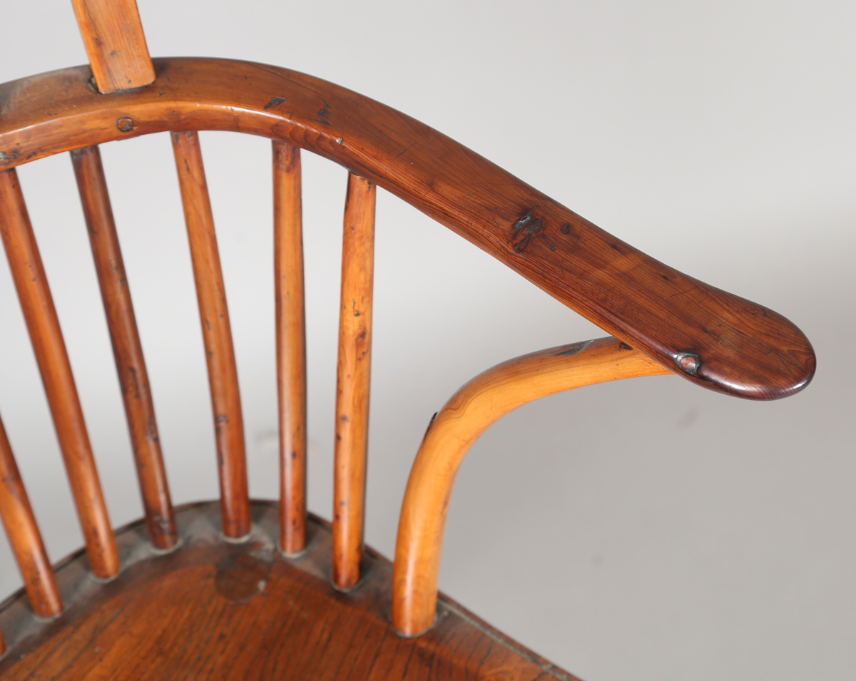 An early Victorian yew and elm stick and wheel back Windsor armchair with shaped panel seat and - Image 10 of 14