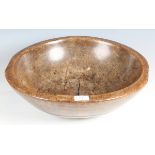An 18th/19th century turned sycamore dairy bowl, diameter 45.5cm.Buyer’s Premium 29.4% (including