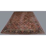 A Tabriz carpet, Central Persia, mid-20th century, the pink field with overall palmettes and