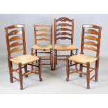 A pair of late George III provincial ash ladder back chairs with rush seats, height 98cm, width
