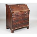 A small George III mahogany bureau, fitted with four oak-lined drawers, height 94cm, width 77cm,