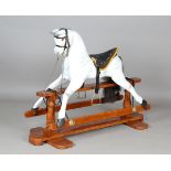 A 20th century painted wooden rocking horse, the stand bearing brass plaque detailed 'Lucky Restored